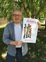 PosterOfMuses David holding a poster of muses